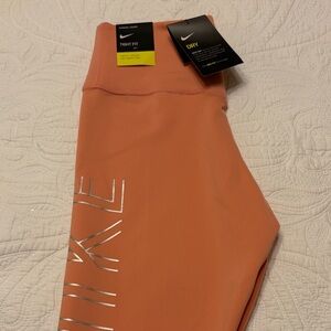 Nike Dri-FIT Orange Tights with Metallic Logo